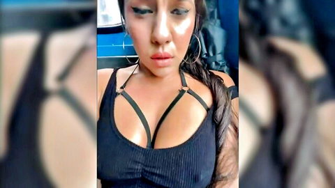 Sexy Latina in black harness top showing cleavage on public bus