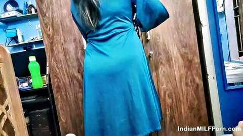 Sensual Indian MILF in tight blue dress, elegant rear view curves