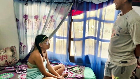 Saraymike sits seductively on bed in tube top as boyfriend stands smiling nearby
