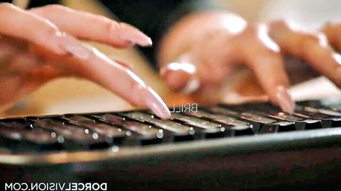 Elegant French woman typing on keyboard with long pink nails