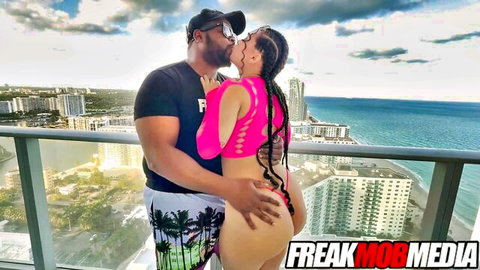 Curly Rican kissed passionately on balcony, ass grabbed in pink mesh top