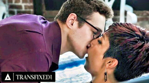 Passionate kiss between short-haired trans babe and boyfriend in purple shirt poolside