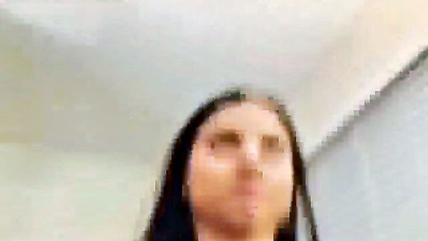 Hot Latina webcam girl with seductive open-mouth expression in steamy show