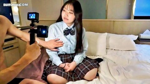 Stunning E-cup Asian beauty in school uniform teased on bed