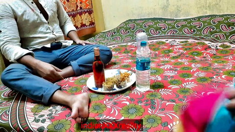 Indian man in casual attire sits on bed with snacks and drinks, teasing step-sister-in-law encounter