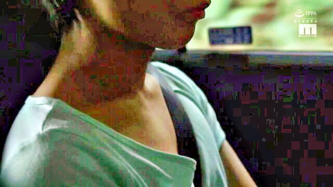 Closeup of sexy Asian woman's bare neck and shoulder in green tank top teasing viewers