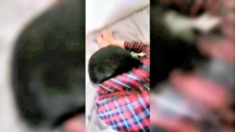 Shy Pakistani girl Ivy Winterz lying in plaid shirt on bed