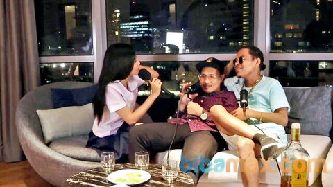 Asian woman and two men in casual podcast chat, 2024 episode