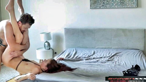 Rough sex intensity: tattooed man lifts brunette's leg for deep penetration in orgasmic fuck