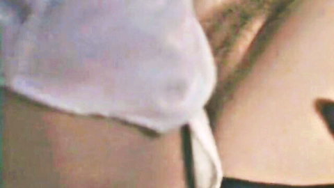 Vintage 1979 retro porn close-up of woman in white panties exposing bushy pubic hair