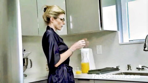 Cory Chase as stepmom in silky robe pouring drink in kitchen tease