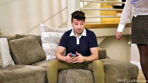 Ryan Keely in sheer blouse and skirt teases man on couch in Big Tit MILFS
