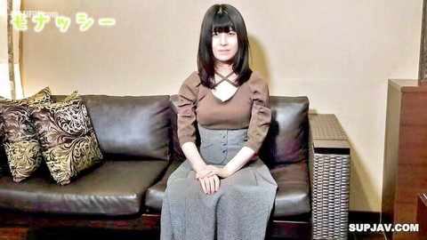 20-year-old Japanese college girl Mayumi in brown blouse and gray skirt, seated casually