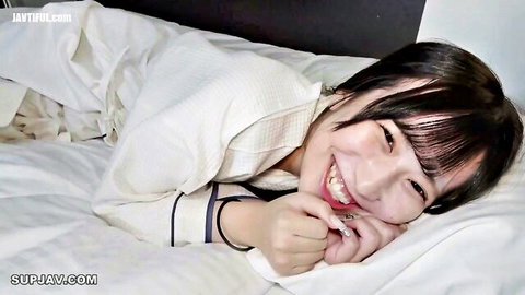 Moka smiling in white yukata on bed, graduation celebration