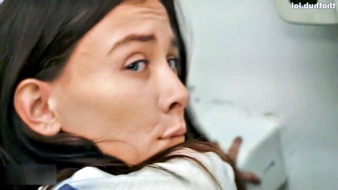 Brunette beauty with wide eyes and open mouth in surprised aroused expression wearing white top