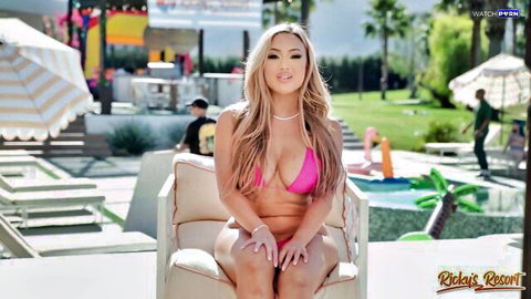 Kazumi in revealing pink bikini poolside at Ricky's Room