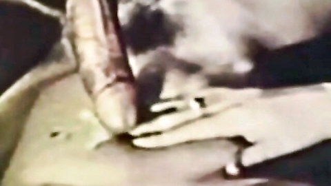 Close-up of blonde woman stroking erect cock in classic Tabu Film porn