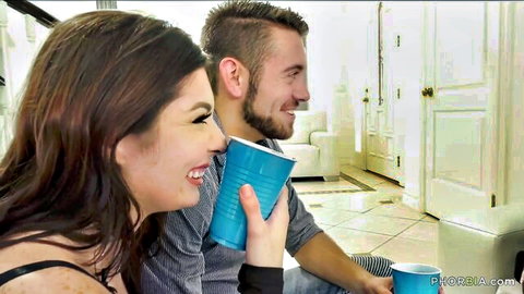 Smiling brunette woman and bearded man sharing blue cups in bisexual tease