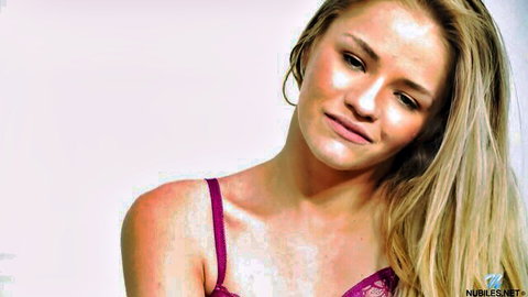 Blonde cam girl in purple lingerie teases with seductive gaze in hot solo play