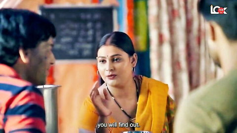 Indian mature housewife in yellow saree gesturing seductively in classroom with men