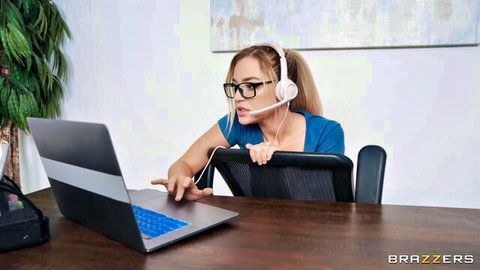 Blake Blossom as busty blonde in office headset, teasing gaze