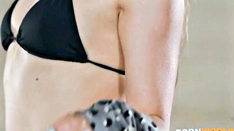 Talia Mint in black bikini top, teasing arm pose, slim nude tease