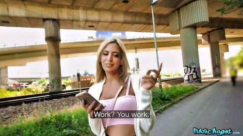 Dulce Maylen posing outdoors in Public Agent scene, blonde in white cardigan