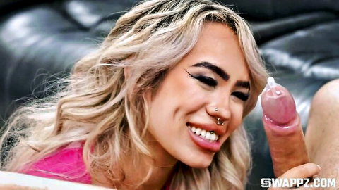 Luna Luxe teasing big condom-covered dildo with smile