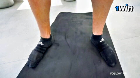 Kriss Kiss athletic legs in black Adidas socks during workout
