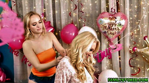 Blonde stepmom in orange tube top hugs stepdaughter on Mothers Day