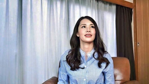 Busty Asian wife in seductive interview, long dark hair, blue shirt