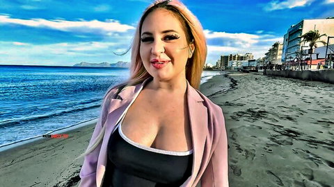 Maria Gail in revealing pink blazer and cleavage on Mallorca beach