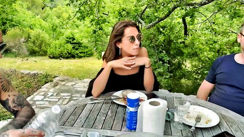 Anissa Kate in casual off-shoulder top at outdoor table with friends, OnlyFans scene