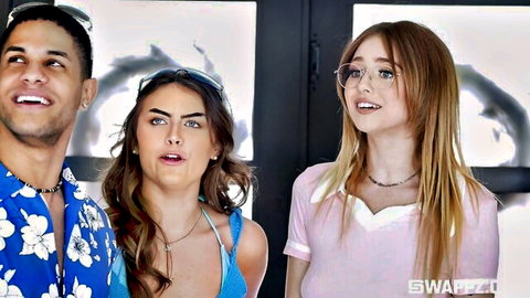 Brunette and blonde women with handsome man in Hawaiian shirt, surprised faces