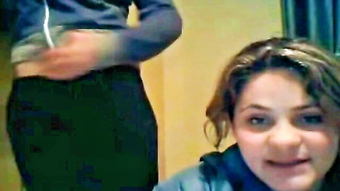 Latina webcam girl in hoodie kneels with mouth open ready to suck cock