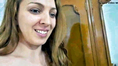 Smiling hot Tunisian Arab beurette with long wavy brown hair, topless tease