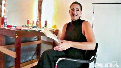 Alison Tyler smiling in black turtleneck at vanity, teasing masturbation scene