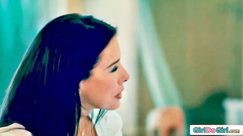 Gia Dibella as seductive stepmom in white top, teasing profile view