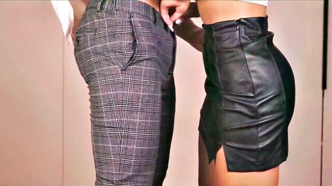 Man gropes curvy woman in tight leather miniskirt while she wears VR glasses unaware