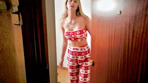 Miss Driada blonde in red poinsettia bikini lingerie standing in doorway