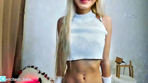 Enchant Baby blonde camgirl in sexy white crop top, teasing midriff