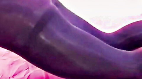 Alex Lexar Iranian transgender legs in purple stockings on pink sheet