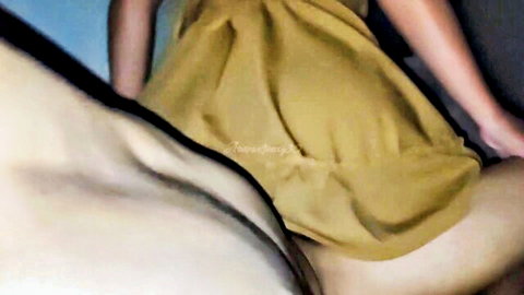 Asian woman in yellow dress exposing wet pussy side view solo tease