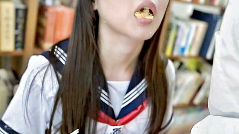 Tsubomi in sailor school uniform teasing with mouth full in JAV scene