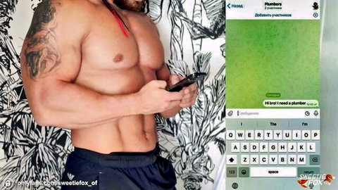 Muscular tattooed man in shorts holding phone, Sweetie Fox plumber roleplay
