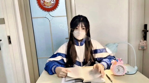 Asian schoolgirl in tracksuit studying at desk with mask, innocent beauty