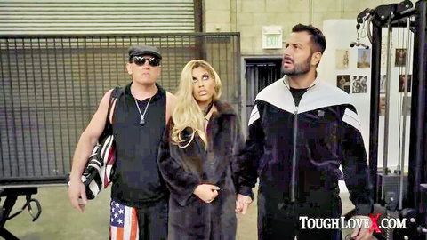 Bridgette B in fur coat with tough guys, ready for rough action at ToughLoveX