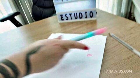 Charmille Roussenq's tattooed hand writing with colorful pen