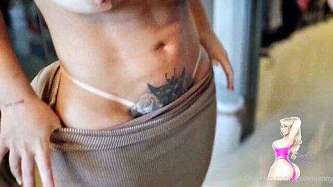 Uptown Jenny teases in sheer thong and skirt, showing lower tattoo