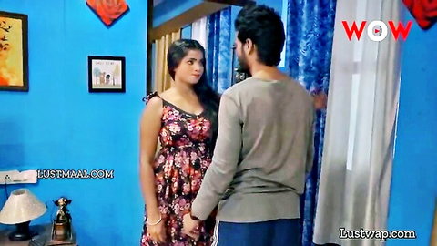 Indian babe in floral strap dress intimately touches boyfriend's arm in bedroom